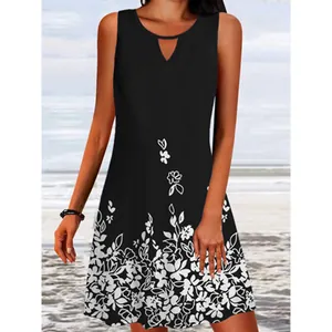 Close-up of sleeveless black dress with white floral print and keyhole neckline