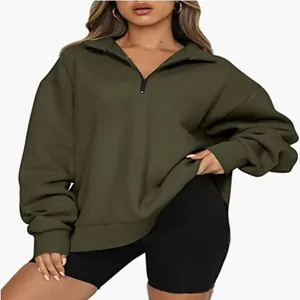 Detail view of olive green women's casual half-zip sweatshirt featuring an oversized fit
