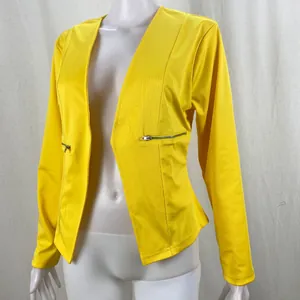 Detailed view of women's bright yellow casual blazer with zipper pockets on a white mannequin