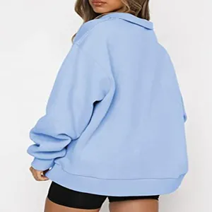 Back view of a light blue oversized half-zip sweatshirt with a relaxed and comfy fit