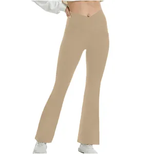 High-waisted flare yoga pants with unique crossover waist design in solid beige color
