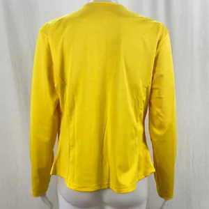 Detailed back view of a vibrant yellow casual zip-up blazer jacket for women on mannequin