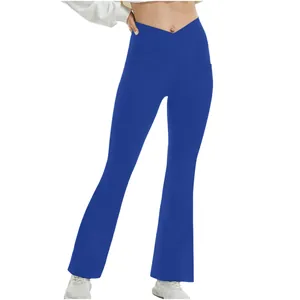 Detail of royal blue flare yoga pants featuring a crossover high waistband design