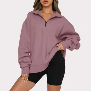 Detailed view of the mauve oversized casual half-zip sweatshirt with a soft fleece lining