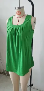 Detailed view of a green pleated square-neck sleeveless tank top on a dress form