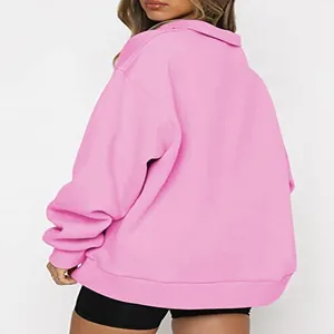 Detailed back view of a cozy pink half-zip fleece sweatshirt for women, relaxed fit