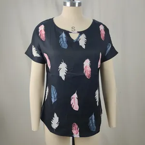 Detail view of black V-neck t-shirt featuring vibrant pink and blue feather prints
