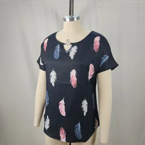 Short-sleeved navy blouse featuring vibrant feather prints and a unique V-cutout neckline