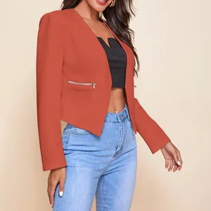 Detailed view of a terracotta cropped blazer for women featuring silver zipper pockets