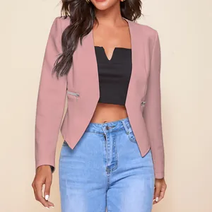 Detail shot of a stylish pink blazer with silver zipper pocket accents for women