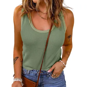 Close-up of a stylish sage green waffle knit U-neck tank top worn with casual jeans