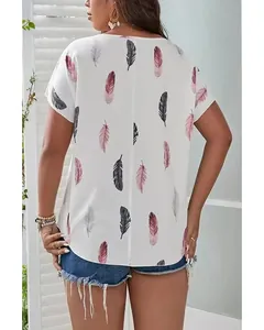 Detail view of plus size women's white blouse with pink and black feather prints.