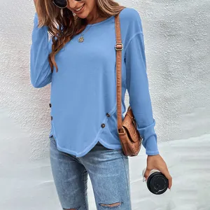 Casual light blue long sleeve t-shirt with button detail and asymmetric hemline