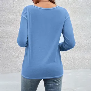 Back view of a casual blue long-sleeved T-shirt with comfortable drop shoulder design