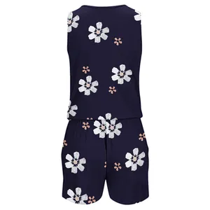 Summer sleeveless floral print romper in navy blue with white and pink flower pattern