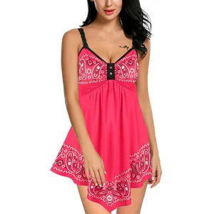 Detail view of sleeveless pink paisley printed dress with irregular handkerchief hemline