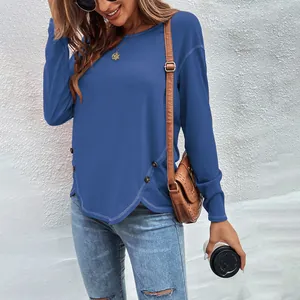 Casual blue long-sleeve T-shirt with stylish irregular hem and side button details.