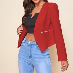 Detail view of a modern red cropped blazer featuring a silver zipper pocket design