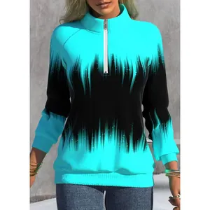 Detail of cyan and black gradient flame print on long sleeve mock neck half-zip sweatshirt