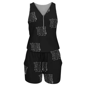 Close-up of black sleeveless romper with white script print and front zipper detail