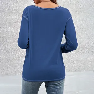 Rear view of a casual blue long-sleeved T-shirt with a stylish irregular curved hemline