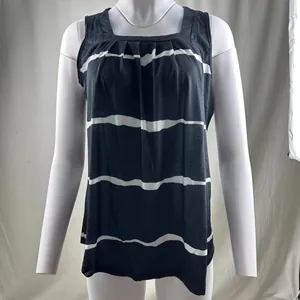 Detailed view of a women's pleated square neck tank top with navy and white stripes