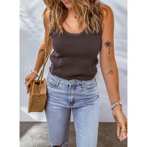 Detailed view of women's grey waffle knit U-neck tank top in a casual summer outfit