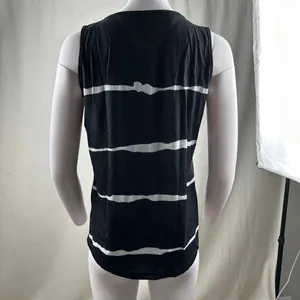 Back view of a women's black and white striped sleeveless tank top with curved hem
