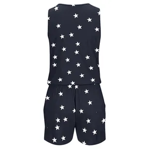 Back view of navy blue sleeveless jumpsuit featuring a white star print pattern.