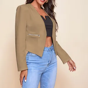 Detailed side view of a tan cropped blazer featuring functional metal zipper pockets