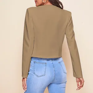 Rear view detail of a khaki cropped blazer jacket for women paired with light blue jeans
