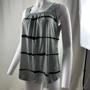 Detailed view of grey square neck tank top with black stripes and elegant pleats.