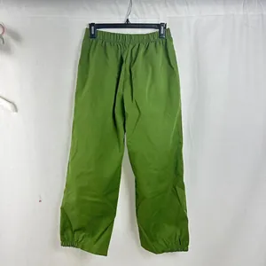 Back view of vibrant green loose casual pants with elastic waistband and cuffs detail.
