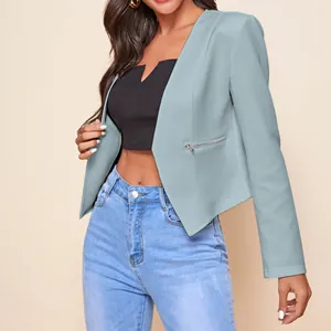 Detail shot of a light blue cropped blazer with zipper accent and asymmetric hem