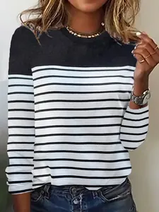 Detail view of a women's round neck long sleeve T-shirt with black and white stripes.