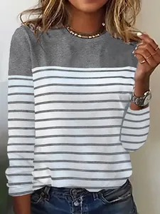 Detailed view of the crew neck striped long sleeve top with a grey color block design