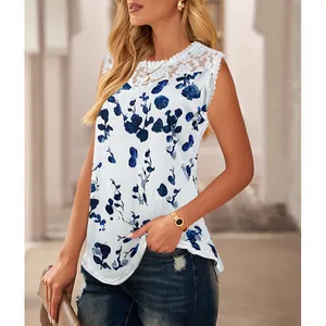 Detail view of women's white sleeveless top with blue floral print and lace neckline