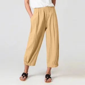 Detailed view of women's loose cotton linen wide-leg cropped pants in light beige color