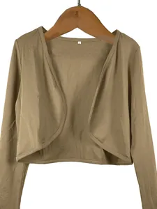 Detailed view of a brown cropped open-front bolero shrug cardigan with long sleeves