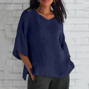 Loose-fit navy blue V-neck top with half sleeves for a casual and elegant summer style.