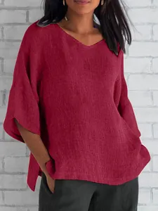 Elegant women's loose red V-neck blouse with half sleeves for casual summer wear