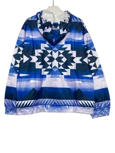 Detail view of a women's ethnic geometric print long sleeve hoodie in blue and white.