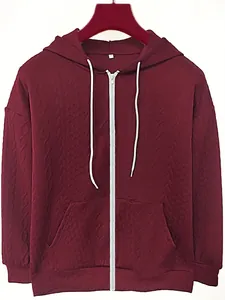 Detailed view of women's maroon jacquard zip-up hoodie with hood and front pocket