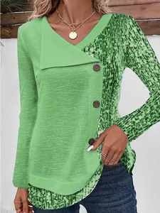 Close-up of green ribbed long-sleeve top with leopard print and button details.