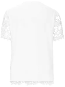Back view of women's white fashion T-shirt with intricate lace sleeves and hem