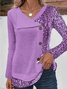 Close-up detail of purple long sleeve V-neck top with rib-knit and leopard print