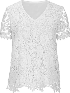 Macro view showing intricate white floral lace texture on elegant short sleeve V-neck blouse