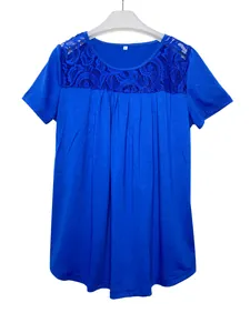 Detail view of blue T-shirt with intricate lace neckline and pleated front design