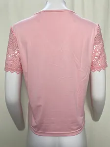 Back view of pink women's fashion top featuring delicate rose patterned lace short sleeves