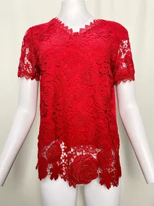 Close-up of red floral lace short-sleeved top showing intricate rose crochet patterns